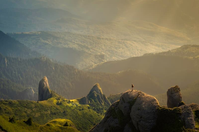 Hiker above a Swiss mountain lake