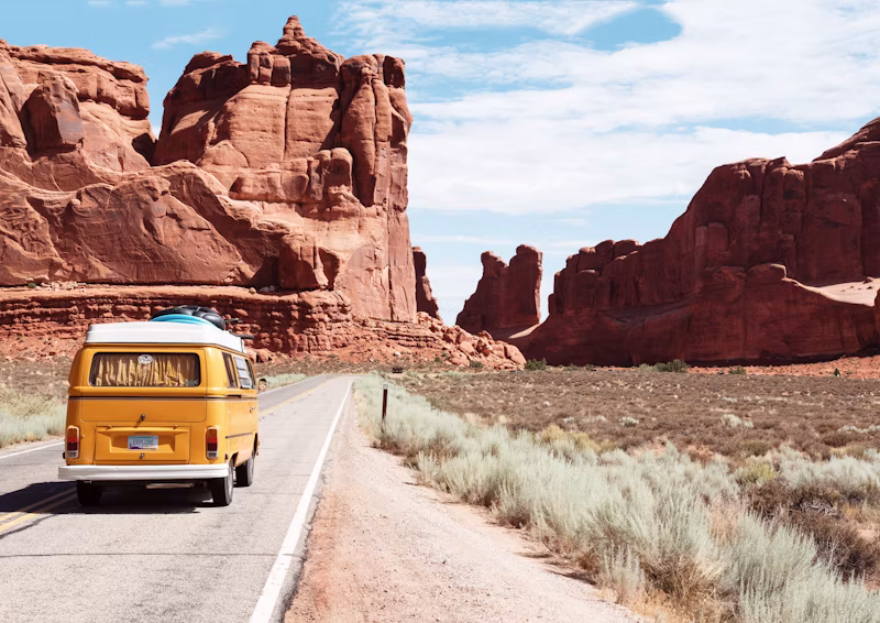 Camper van on a red-rock canyon road